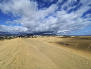 Wide sand dunes under a cloudy sky, Maspalomas Dunes, Gran Canaria, Canary Islands, Spain