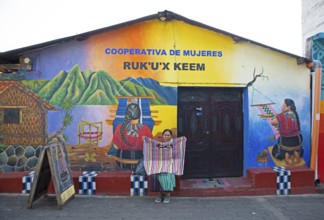 Colourfully painted house facade of a woman's cooperative in San Juan la Laguna, Atitlán, Sololá