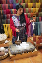 Maya woman, 42 years old, spinning cotton, traditional craft in a woman's cooperative, San Juan la
