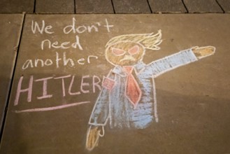 Phoenix, Arizona - Messages written in chalk on the sidewalk at the Arizona State Capitol during a