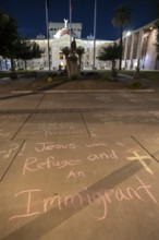 Phoenix, Arizona - Messages written in chalk on the sidewalk at the Arizona State Capitol during a