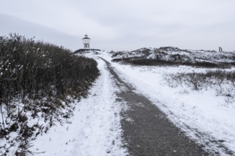 Water tower and dunes in snow, Langeoog, Lower Saxony, Germany