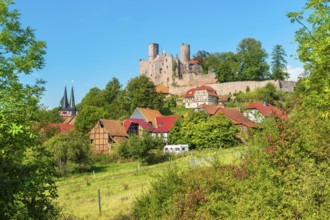 View of the ruins of Hanstein Castle and the small village of Rimbach, half-timbered houses and