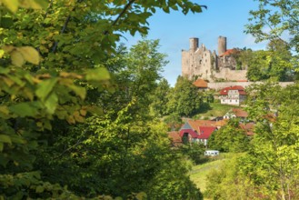 View of the ruins of Hanstein Castle and the small village of Rimbach with half-timbered houses,