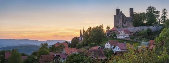 View of the ruins of Hanstein Castle and the small village of Rimbach with village church with