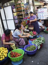 Mayan woman wearing traditional clothes selling vegetables in Santiago de Atitlán, Sololá
