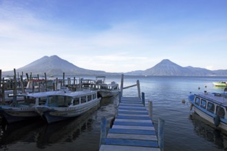 Boats on the pier, Lake Atitlán or Lake Atitlán in the morning, the volcanoes San Pedro, Atitlán