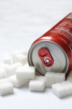 Cola can and lots of sugar cubes