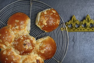 Epiphany cake with crown on wire rack, Switzerland