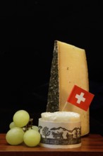 Plate of Swiss cheese, Gstaad mountain cheese with herbs and cream cheese 'Fette Berta',