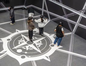 Visitors wearing VAR glasses at Louvre Abu Dhabi, art museum by French architect Jean Nouvel,