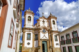 Baroque cathedral facade surrounded by old houses in the historic city of Ouro Preto, Ouro Preto,
