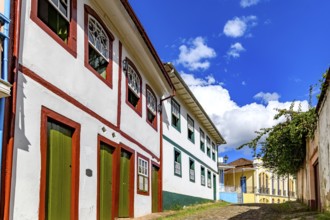 A slope lined with old colonial style mansions in the historic city of Ouro Preto, Ouro Preto,