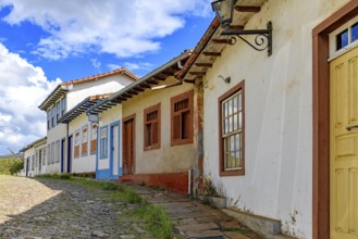Picturesque street with colorful colonial houses, weathered by time, in Ouro Preto, Ouro Preto,