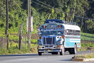 Blue bus on the main street in Panajachel, Atitlán, Sololá Department, Guatemala