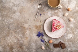 Chocolate cake on brown concrete background, cup of coffee, top view, flat lay, copy space