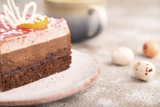 Chocolate cake on brown concrete background, cup of coffee, side view, close up, selective focus