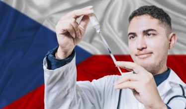 Doctor holding syringe on Czech Republic flag background. Medical professional holding syringe with