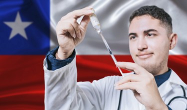 Doctor holding syringe on Chile flag background. Medical professional holding syringe with Chilean