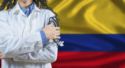 Healthcare professional with Colombia flag background. Professional doctor holding stethoscope on