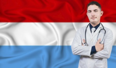 Portrait of medical professional on Luxembourg flag background. Luxembourgish national health