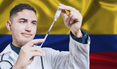 Doctor holding syringe on Colombia flag background. Medical professional holding syringe with