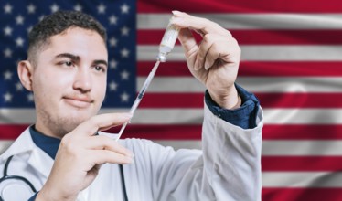 Doctor holding syringe on United States flag background. Medical professional holding syringe with