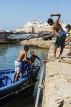 Children playing on the promenade, Essaouira, UNESCO World Heritage Site, Atlantic coast, Morocco