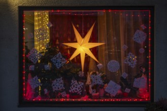Christmas decorated and illuminated shop window with Christmas stars and fairy lights, Sysmä,