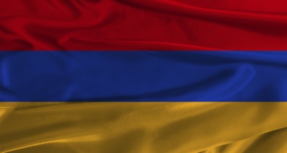 Flag of Armenia with fabric textured background. Close up of National flag of Armenia with