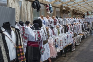 Shop selling Romanian traditional costume clothing for tourists, Vorone?, Romania