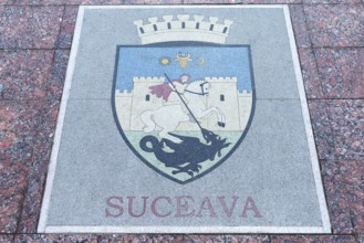 Base plate, coat of arms of Suceava, Romania, on the central square in Czernowicz, Ukraine