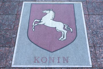 Base plate, coat of arms of Konin, Poland, on the central square in Czernowicz, Ukraine