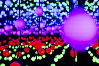 Light, glowing balls, LED lamps, hang in series, side by side, on top of each other, change their