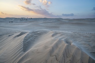 Sunset, white sand dunes in the Khaluf desert, Oman