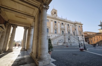 Arcade, columns of the Palazzo Nuovo in the morning light, Senators' Palace (Palazzo Senatorio) in