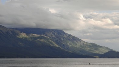 Landscape view of hills under a cloud cover, bordering a lake, Lake Ohrid, North Macedonia