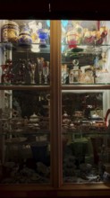 Showcase with illuminated decorative glassware and antiques, Prague, Czech Republic