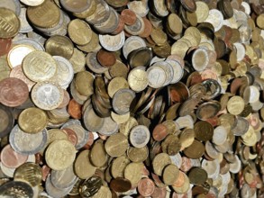 Different coins in a colorful collection in a heap