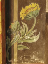 Decorative wall mural with yellow flower and stylized leaves