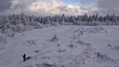 Snowy landscape with a wide view under blue, cloudy sky. Lonely and quiet, Schneeberg,