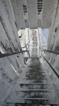 Snowy, icy staircase offers interesting perspective and structural details, Schneeberg,