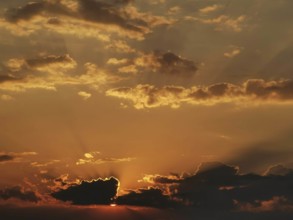 Dramatic sunset with glowing clouds and rays