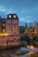 Dean Village, Edinburgh, Scotland, UK. Traditional houses and church with canal in historic Dean