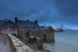 Lerwick, Shetland Islands, Scotland, UK. A traditional stone house at the sea near the port in