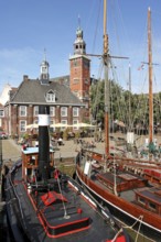 Museum harbour, museum ships, historic scales and the town hall, Leer, East Frisia, Germany