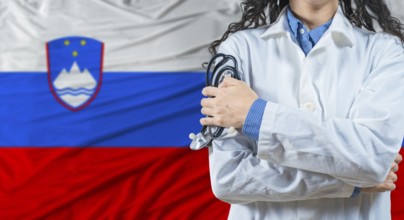 Healthcare professional with Slovenia flag background. Professional doctor holding stethoscope on