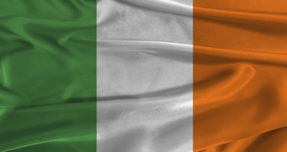 Flag of Ireland with fabric textured background. Close up of National flag of Ireland with