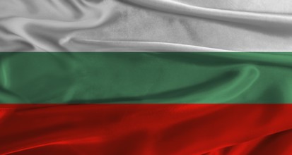 Flag of Bulgaria with fabric textured background. Close up of National flag of Bulgaria with