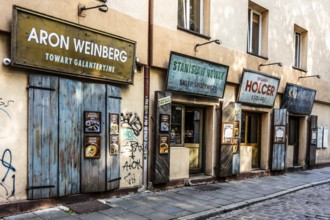 Shop fronts on Szeroka Street, signs bearing Polish and Jewish names, Kazimierz, a historically